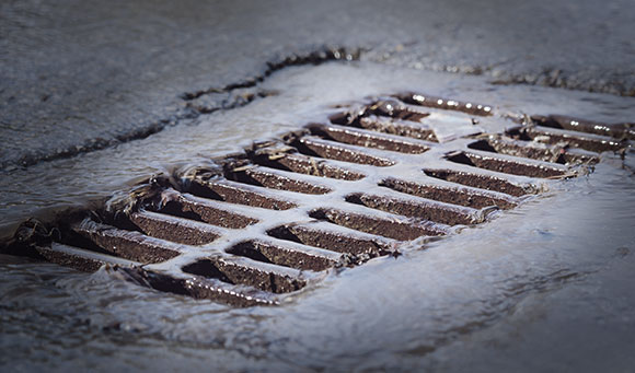 Stormwater inlet grate after a rainfall